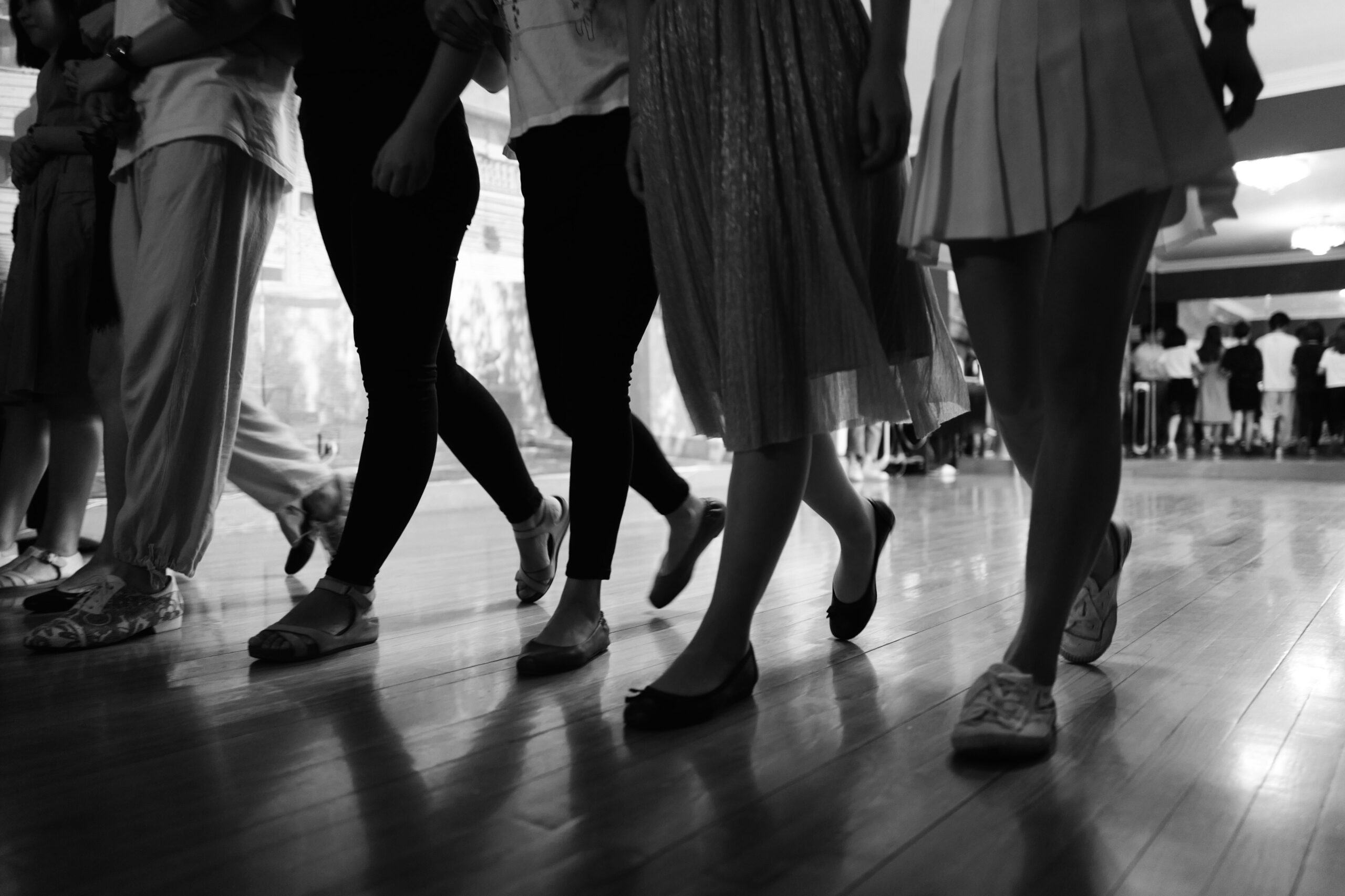 low-section-people-dancing-hardwood-floor